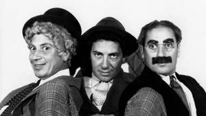 Vintage Headshots Of The Iconic Marx Brothers Wallpaper