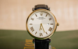 Vintage Rolex Wristwatch With Earth’s Globe: Timeless Luxury Wallpaper