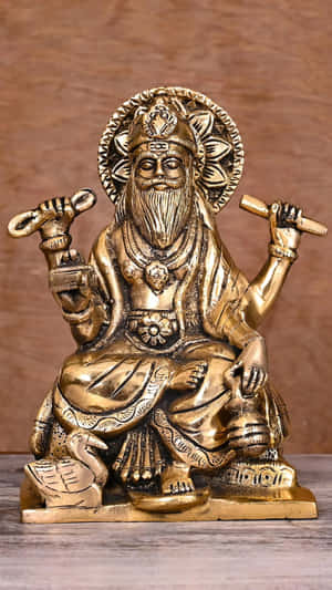 Vishwakarma Statue Bronze Finish Wallpaper