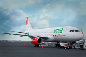 Viva Aerobus Parked Under Sky With Clouds Wallpaper