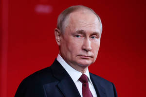 Vladimir Putin Against Blurry Red Backdrop Wallpaper