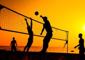 Volleyball Spike At Sunset Wallpaper
