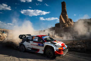 W R C Rally Car Dusty Trail Speed Wallpaper