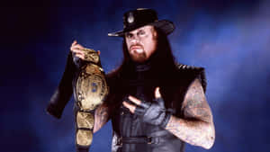 W W E Undertaker With Championship Belt Wallpaper