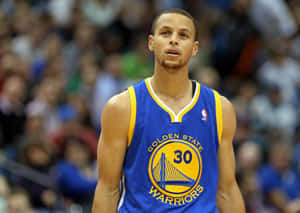 Warriors Basketball Player In Action Wallpaper
