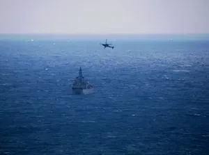 Warship Camouflaged In The Ocean Wallpaper