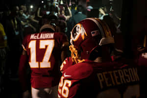 Washington Football Team In Action On The Field Wallpaper