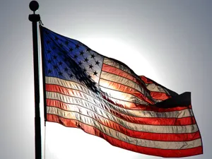 Waving American Flag In The Sun Wallpaper