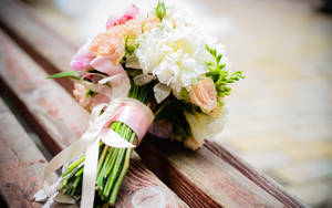 Wedding Bouquet On Wooden Bench Wallpaper