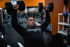 Weightlifting Man Double Dumbbells Wallpaper