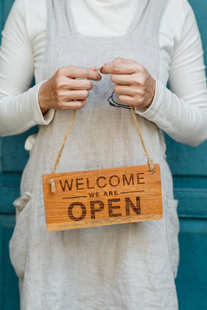 Welcoming Open Signage Wallpaper