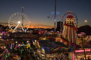 Well-lit Fair At Night Wallpaper