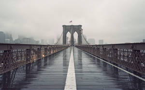 Wet Walkway On The Brooklyn Bridge Wallpaper