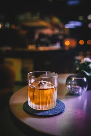 Whiskey Glass On Coaster Wallpaper