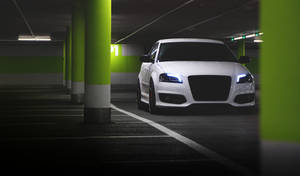 White Audi In Neon Parking Lot Wallpaper