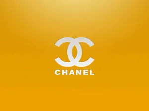 White Chanel Logo On Golden Yellow Wallpaper