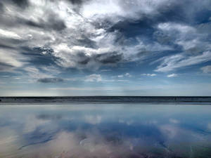 White Cloudy Sky On Woolacombe Beach Wallpaper