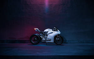 White Motorcycle In Bluish Purple Background Wallpaper