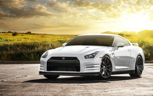 White Nissan Gtr Car Near The Green Field Wallpaper