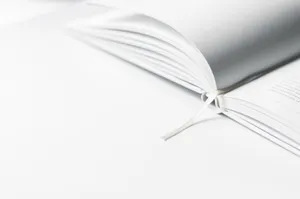 White Opened Book With Marker Wallpaper