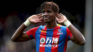 Wilfried Zaha Holding Hands To Ears Wallpaper