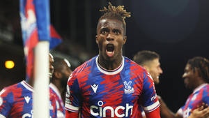 Wilfried Zaha Shouting With Teammates Wallpaper