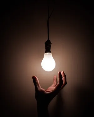 Wise Person Reaching For Light Wallpaper