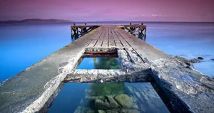 Witness The Beautiful Colors Of A Blue And Purple Sunset In Nature. Wallpaper