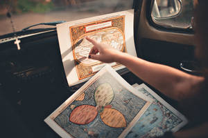 Woman Analyzing A Reference Map Wallpaper