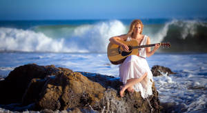 Woman Beach Playing Guitar Wallpaper