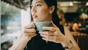 Woman Enjoying Morning Coffee Wallpaper