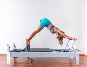 Woman Exercising Pilates Wallpaper