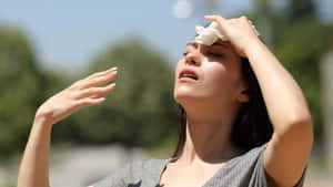 Woman Experiencing Heat Exhaustion.jpg Wallpaper