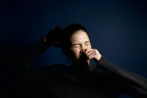 Woman Holding Sneeze Wallpaper