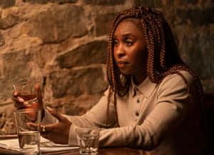 Woman Holding Whiskey Glass Wallpaper