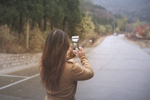 Woman Taking Road Photo Wallpaper