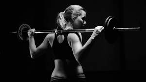 Woman Weightlifting Fitness Equipment Wallpaper