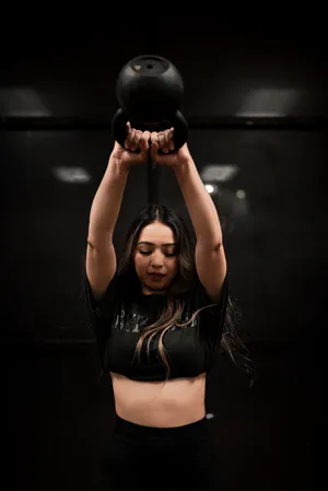 Woman Weightlifting Kettlebell Wallpaper