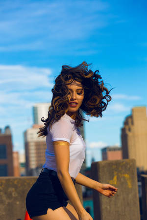 Woman With Bouncy Curly Hair Wallpaper