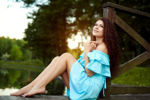 Woman With Curly Hair Blue Dress Wallpaper