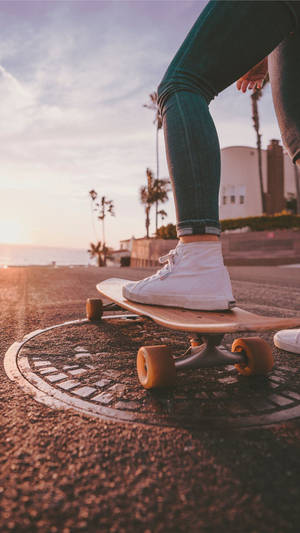 Woman With Wooden Skateboard Iphone Wallpaper