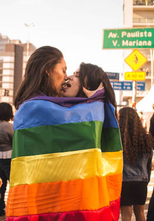 Women Kissing With Flag Wallpaper