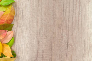 Wooden Background With Rustic Fall Leaves Wallpaper
