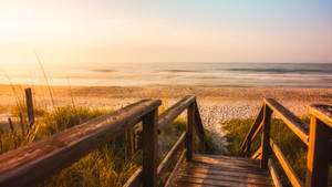 Wooden Boardwalk On A Beach Sunrise Wallpaper