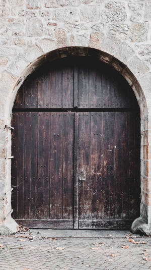 Wooden Door With Faded Black Paint Wallpaper