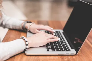 Work Girl Typing On Laptop Wallpaper