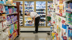 Working Man In The Grocery Store Wallpaper