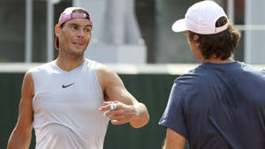 World-renowned Tennis Player Carlos Moya Poses In A White Tank Top Wallpaper