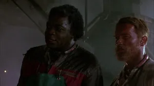 Yaphet Kotto And Arnold Schwarzenegger In The Running Man Wallpaper