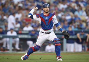 Yasmani Grandal Throwing Baseball As Catcher Wallpaper